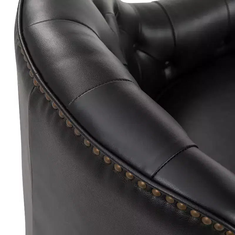 Poltrona a barilotto imbottita in vera pelle, larghezza 72,4 cm, con gambe in legno massello