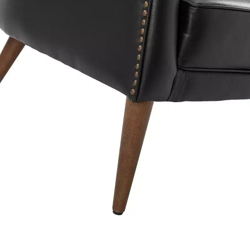 Poltrona a barilotto imbottita in vera pelle, larghezza 72,4 cm, con gambe in legno massello