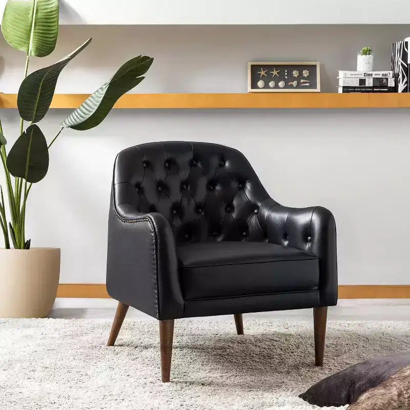 Poltrona a barilotto imbottita in vera pelle, larghezza 72,4 cm, con gambe in legno massello