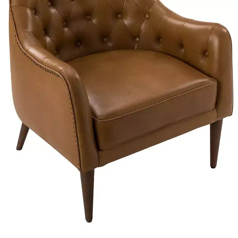 Poltrona a barilotto imbottita in vera pelle, larghezza 72,4 cm, con gambe in legno massello